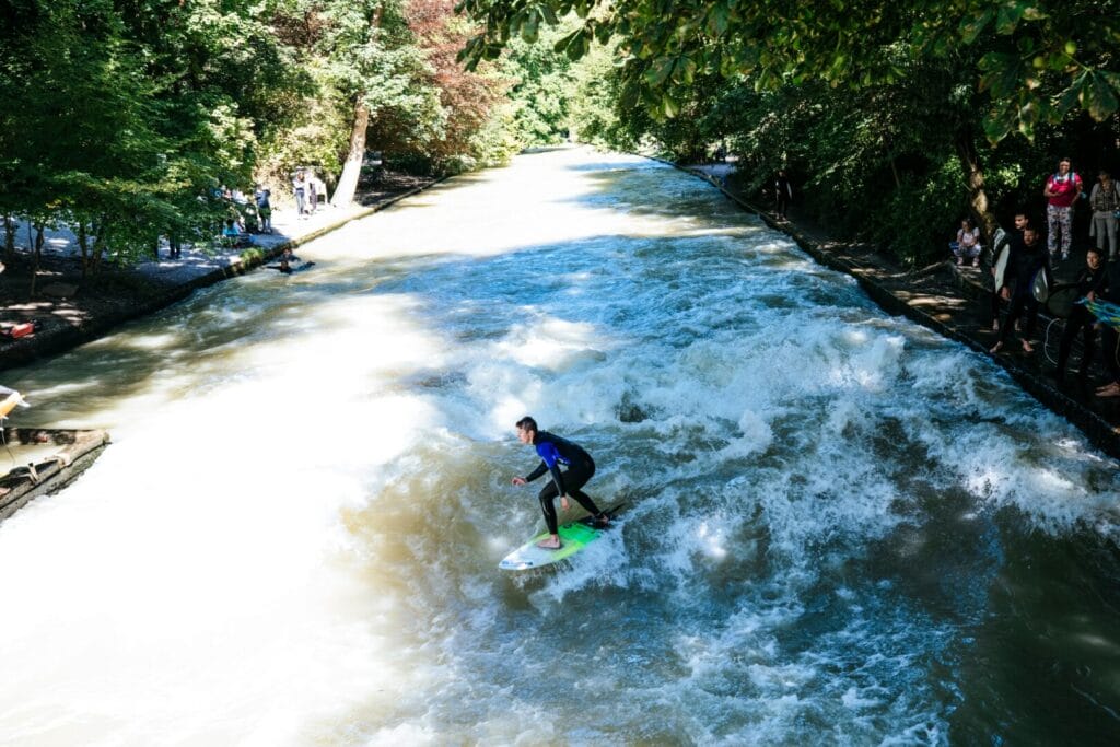 River surfers on the Eisbach in Munich's Englischer Garten