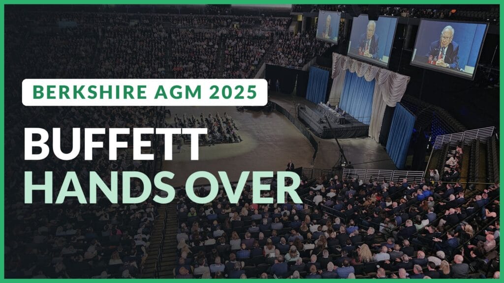 Berkshire Hathaway annual meeting arena in Omaha with Warren Buffett on the big screens. Text: Buffett hands over
