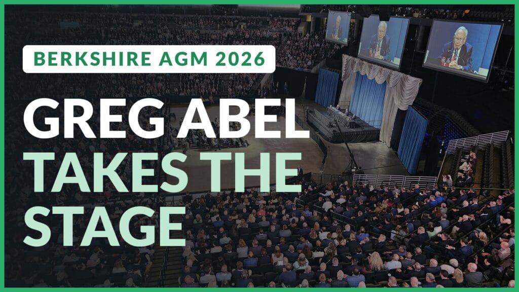 Berkshire Hathaway annual meeting arena in Omaha with Warren Buffett on the big screens. Text: Greg Abel takes the stage