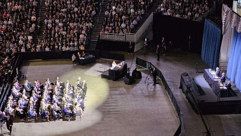 The arena floor with the directors section and the head table at the 2024 Berkshire Hathaway meeting