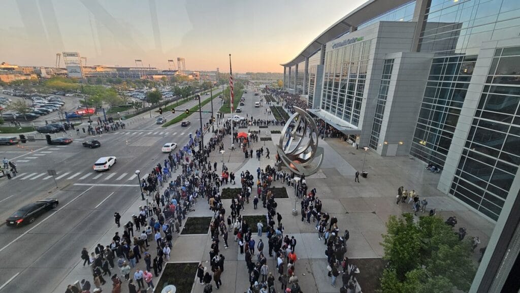 Shareholders lining up outside the CHI Health Center in Omaha at sunrise before the 2025 Berkshire Hathaway annual meeting
