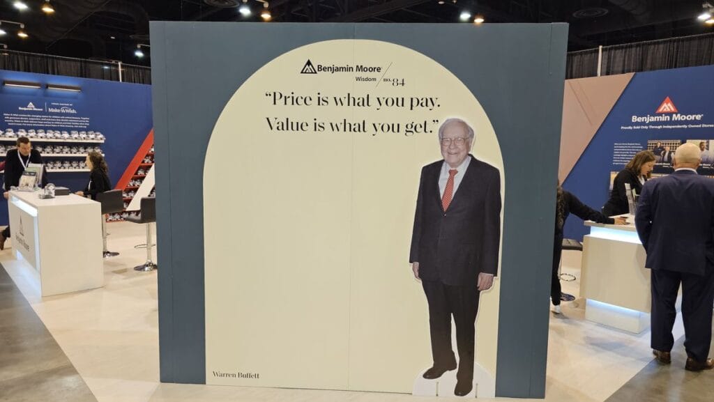 Warren Buffett cutout with the line Price is what you pay, value is what you get in the exhibition hall, 2025