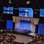 The stage at the 2026 Berkshire Hathaway annual meeting with Greg Abel on the screens