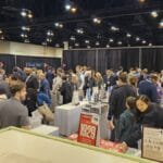 Shareholders browsing Berkshire books at the bookstore stand in the exhibition hall, 2026 Berkshire Hathaway meeting