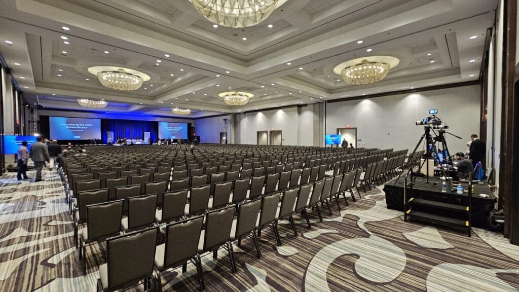 Rows of empty chairs and the camera platform in the ballroom before the Markel Omaha Brunch 2025