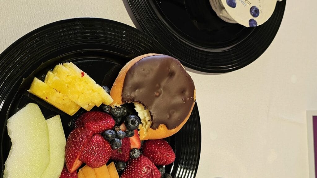 Brunch plate with fruit and a cookie at the Markel Omaha Brunch 2025